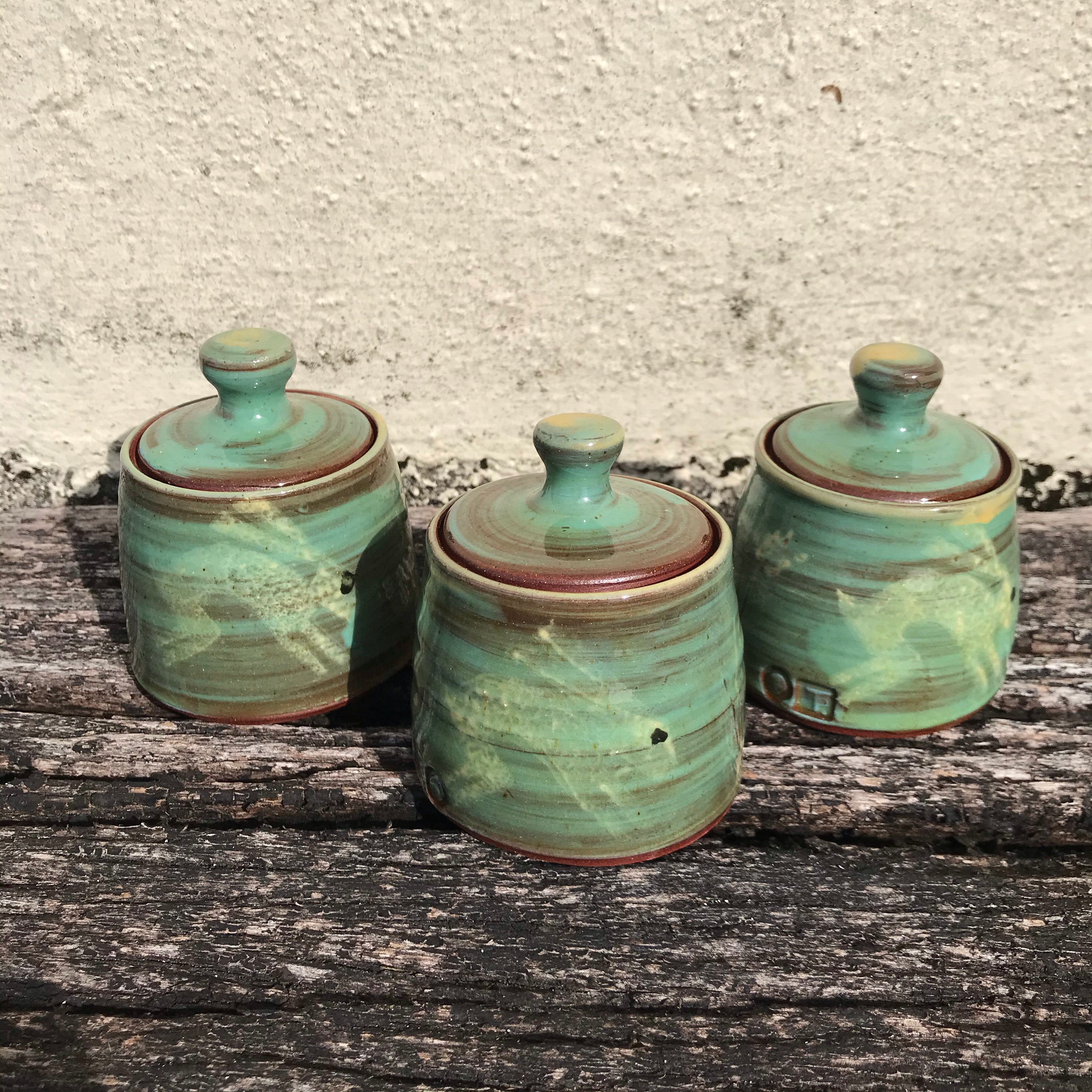 Turquoise lidded Pot with Hares